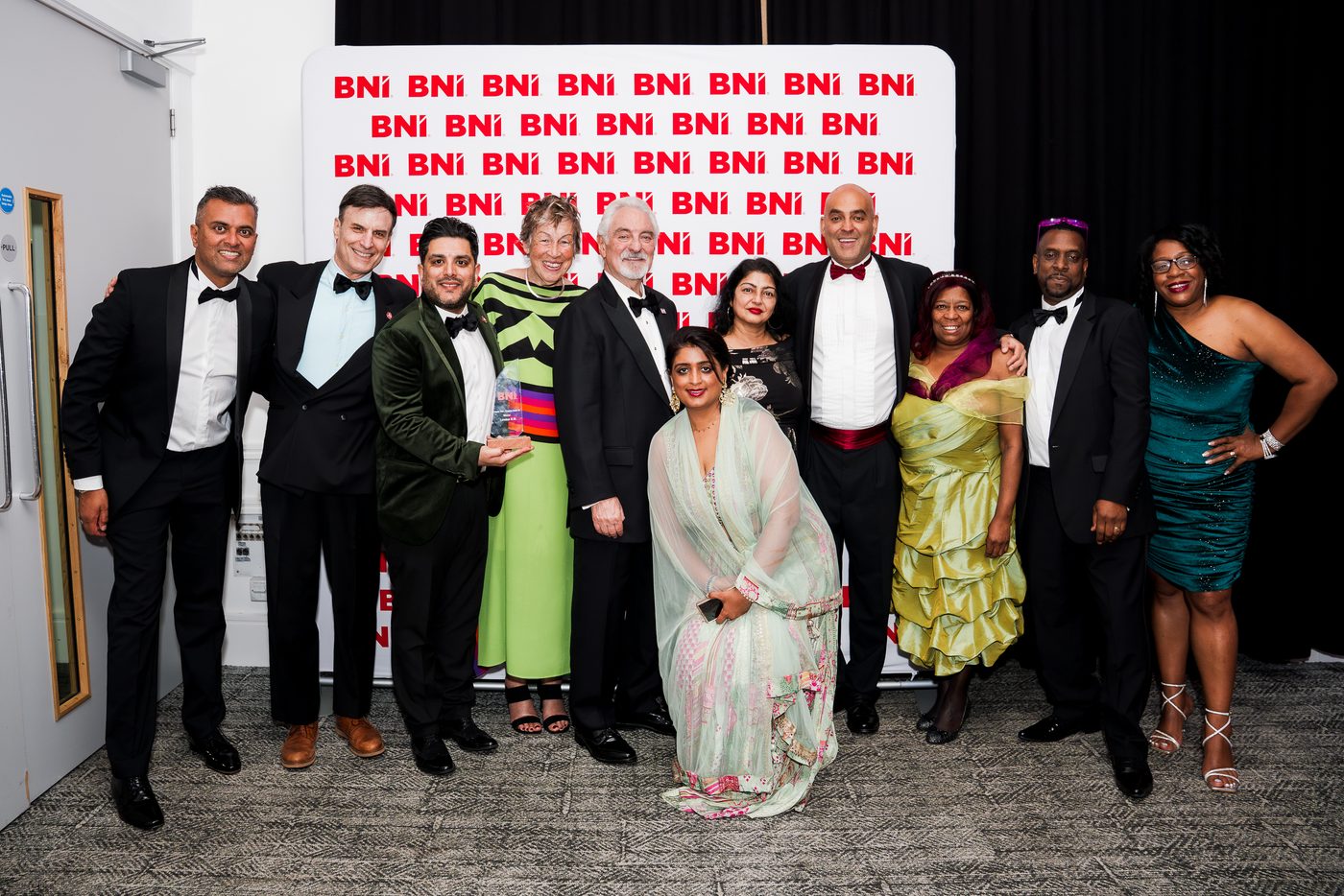 The BNI London North West team at a regional awards night, holding one of the region's awards